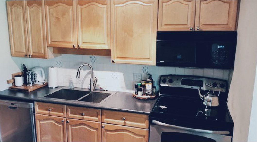 Before: the same kitchen with older wood cabinet fronts